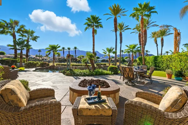 a view of a swimming pool and sitting area