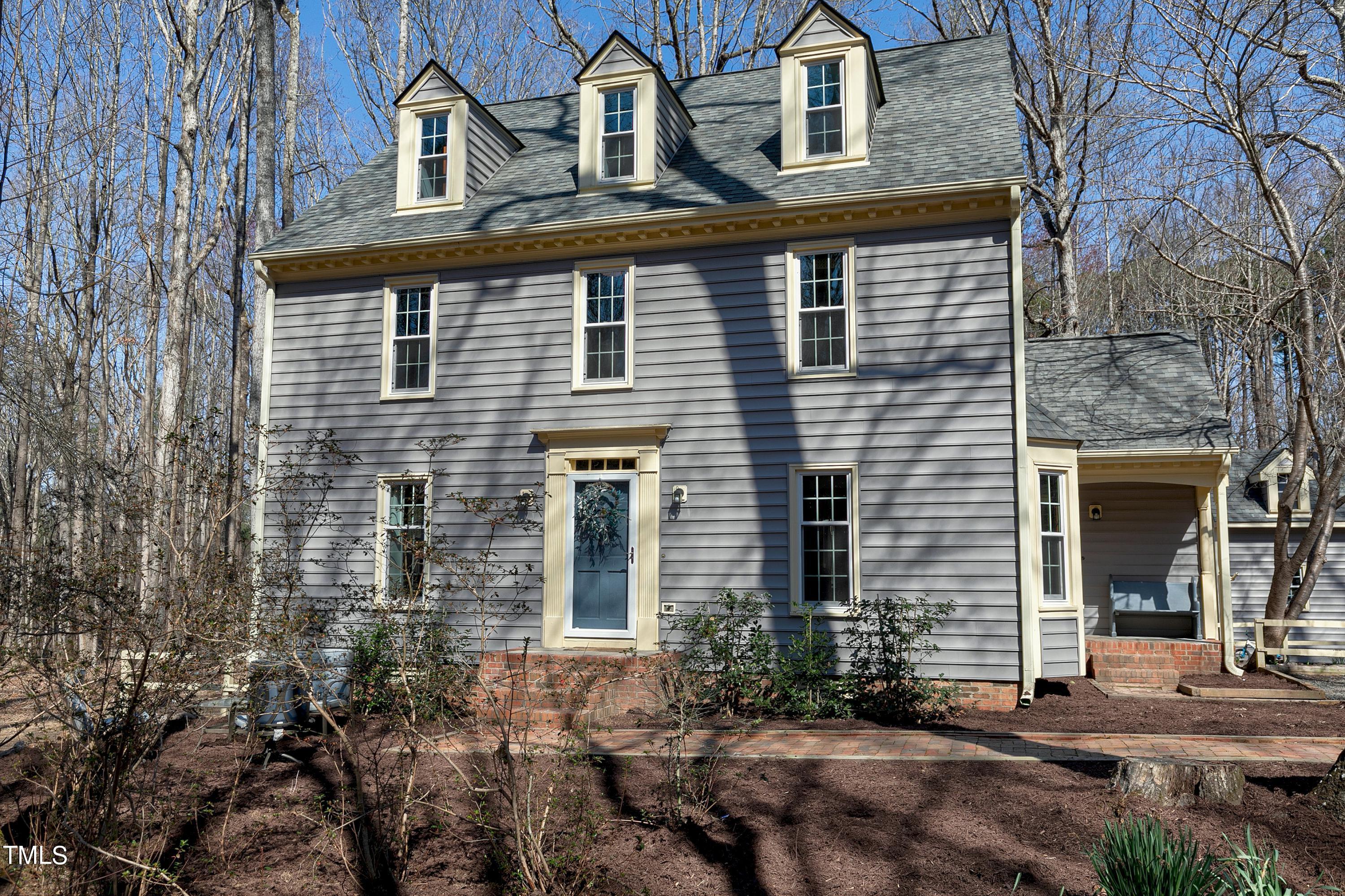 10021 Sycamore Road Raleigh, NC 27613 - Photo 1 of 40 front view of a house with a yard