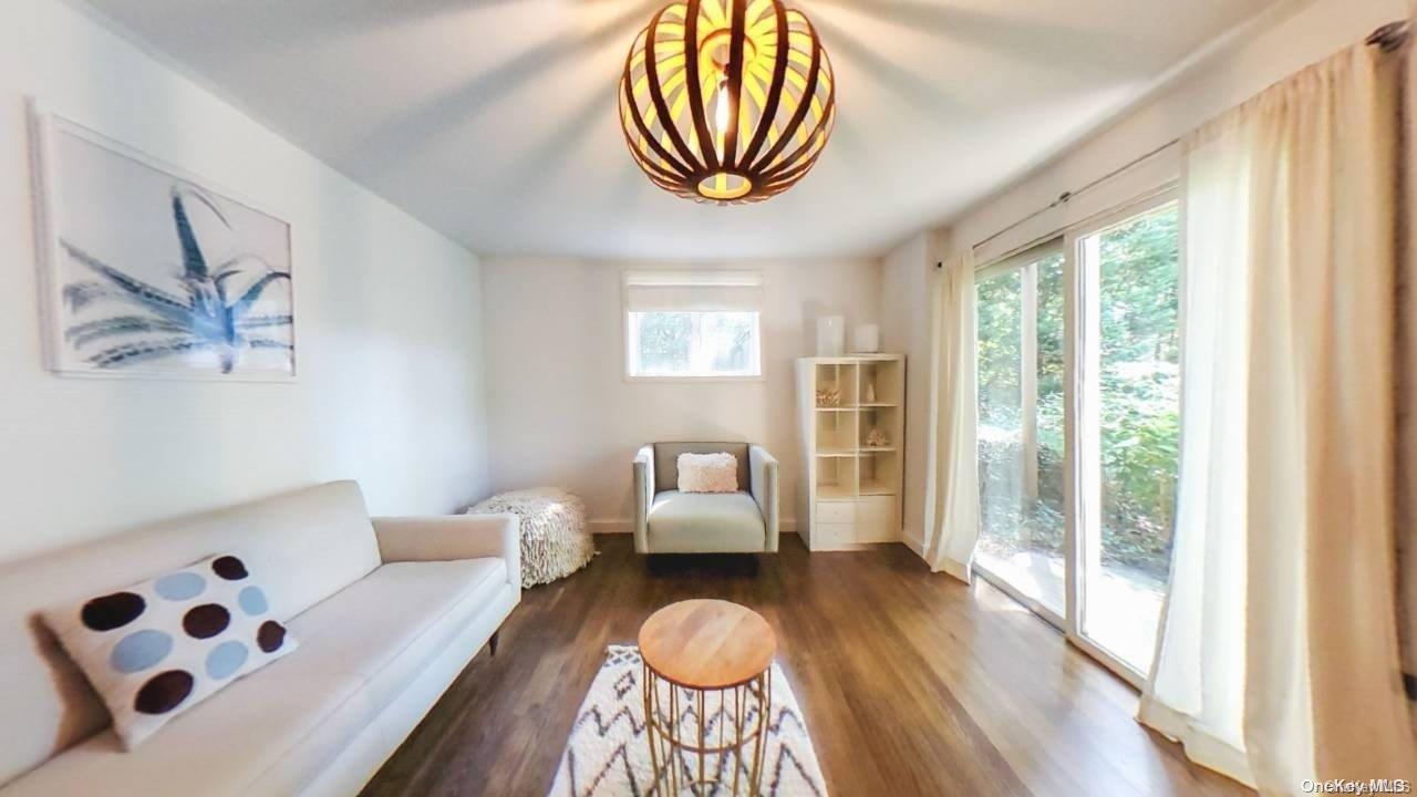 a bedroom with furniture and wooden floor