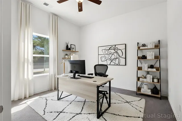 a work room with furniture and a window
