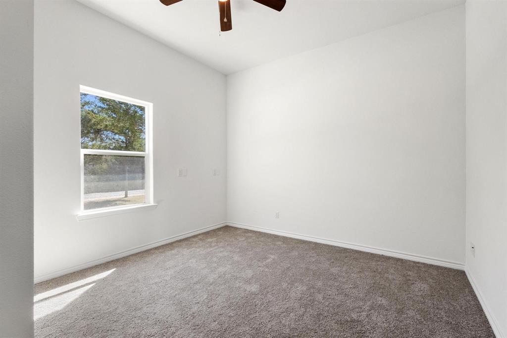 850 County Road Honey Grove, TX 75446 - Photo 14 of 40 an empty room with a window