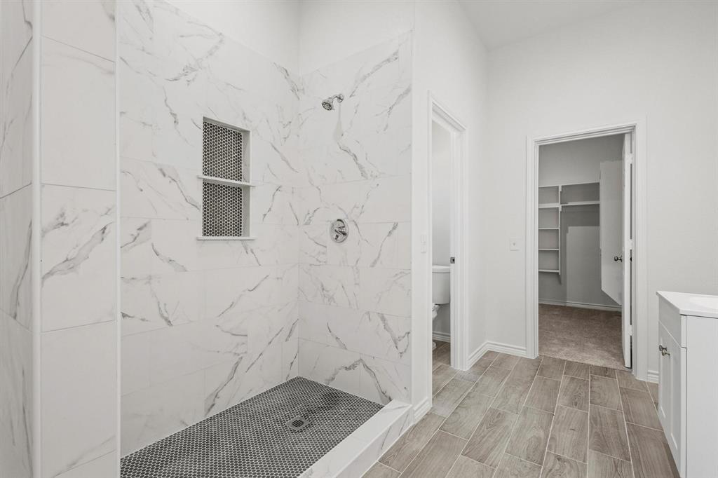 850 County Road Honey Grove, TX 75446 - Photo 20 of 40 a bathroom with a shower and a sink