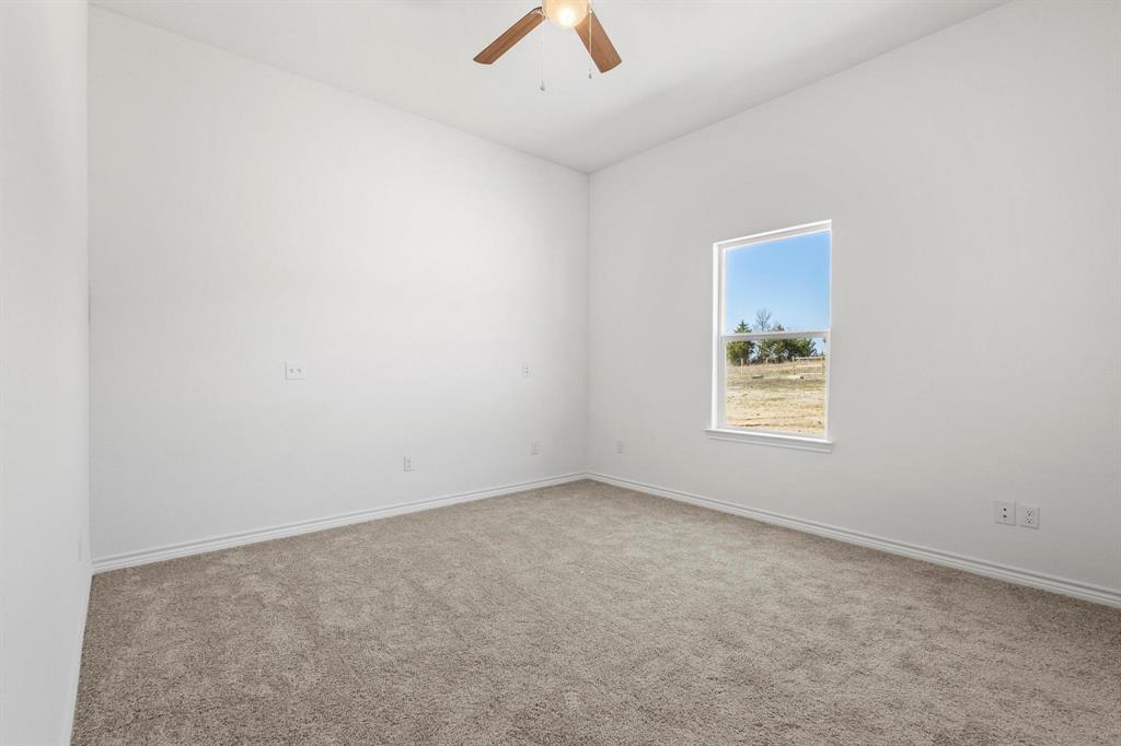 850 County Road Honey Grove, TX 75446 - Photo 24 of 40 an empty room with a fan & a window