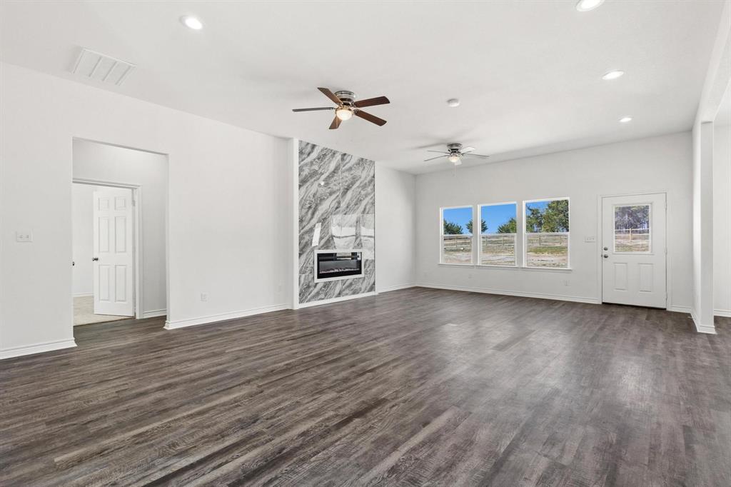 850 County Road Honey Grove, TX 75446 - Photo 3 of 40 wooden floor in an empty room with a window