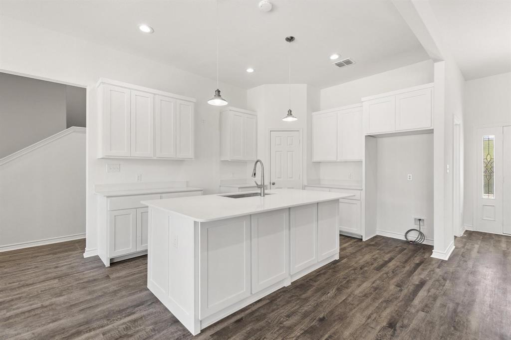 850 County Road Honey Grove, TX 75446 - Photo 6 of 40 a kitchen with a sink stove and cabinets