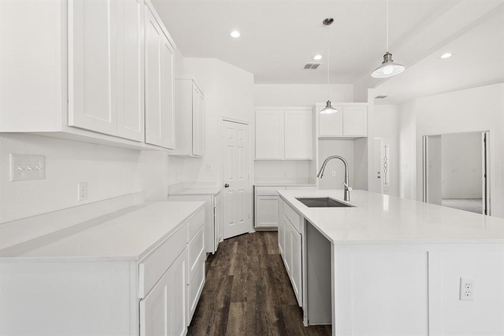 850 County Road Honey Grove, TX 75446 - Photo 9 of 40 a kitchen with a sink stove and cabinets