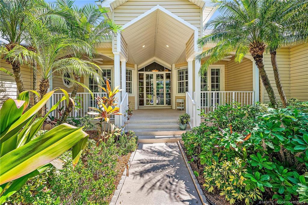 105 Henry Sewall Way Stuart, FL 34996 - Photo 1 of 33 a view of a pathway with a house