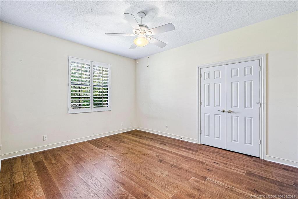 105 Henry Sewall Way Stuart, FL 34996 - Photo 19 of 33 wooden floor in an empty room with a window