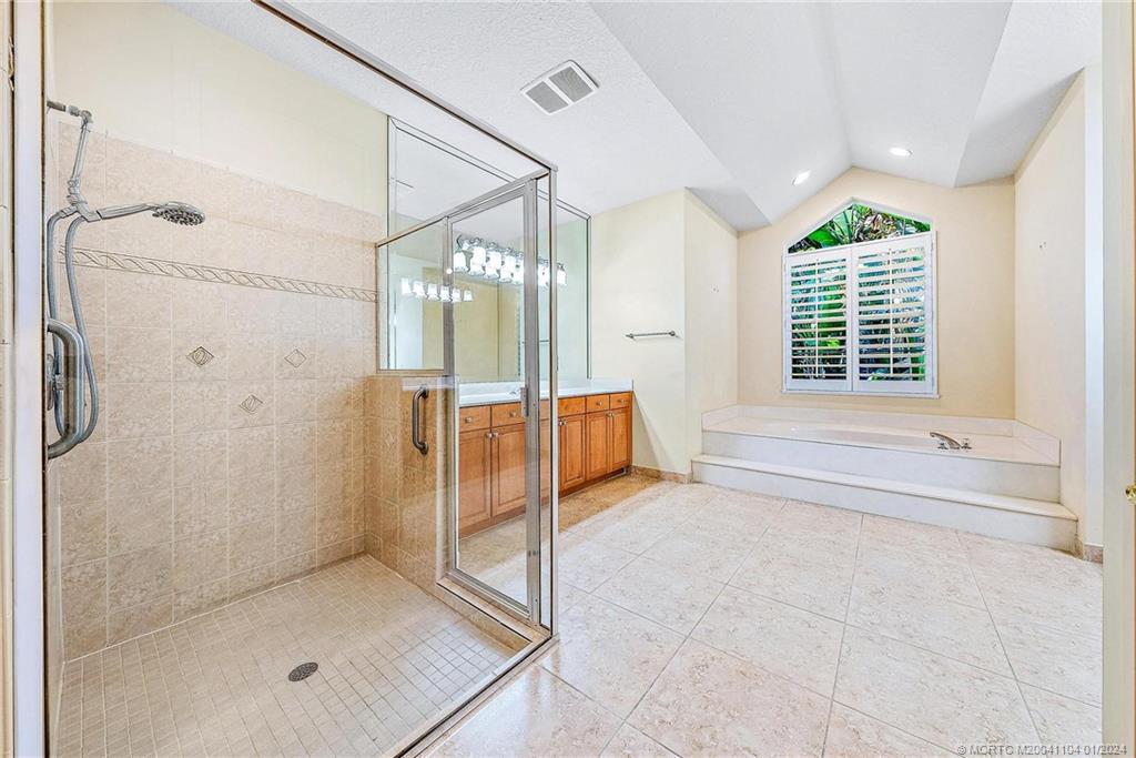 105 Henry Sewall Way Stuart, FL 34996 - Photo 26 of 33 a bathroom with a bathtub and a shower