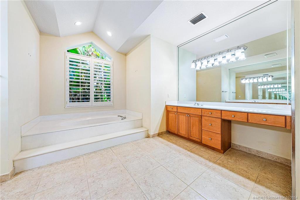 105 Henry Sewall Way Stuart, FL 34996 - Photo 27 of 33 a spacious bathroom with a large tub and shower