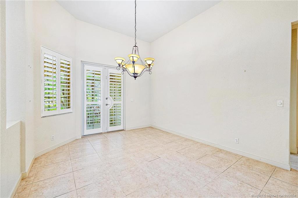 105 Henry Sewall Way Stuart, FL 34996 - Photo 28 of 33 a view of an empty room with a window