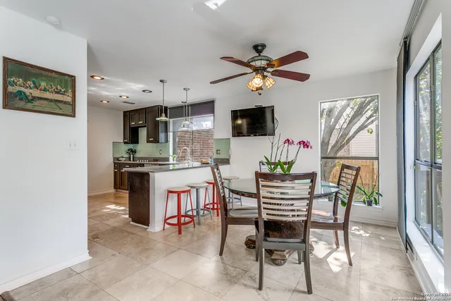 a dining room with furniture and window