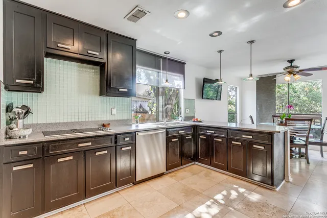 a kitchen with a sink and cabinets