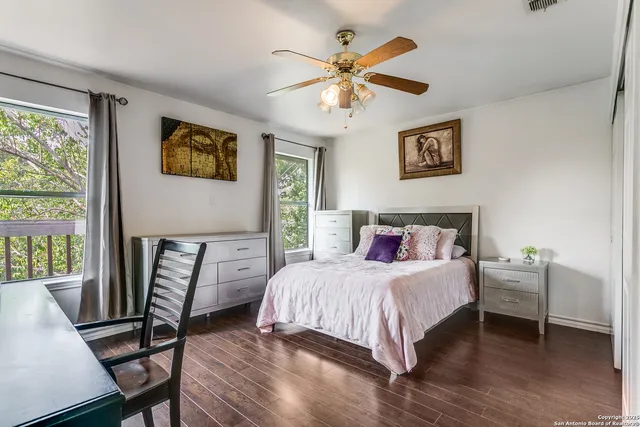 a bedroom with a bed and a table