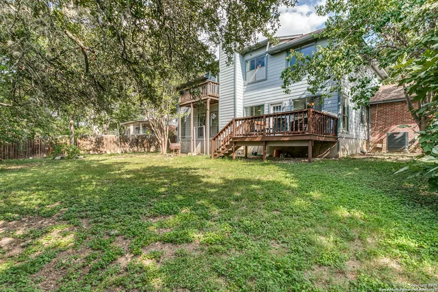a view of a house with a back yard