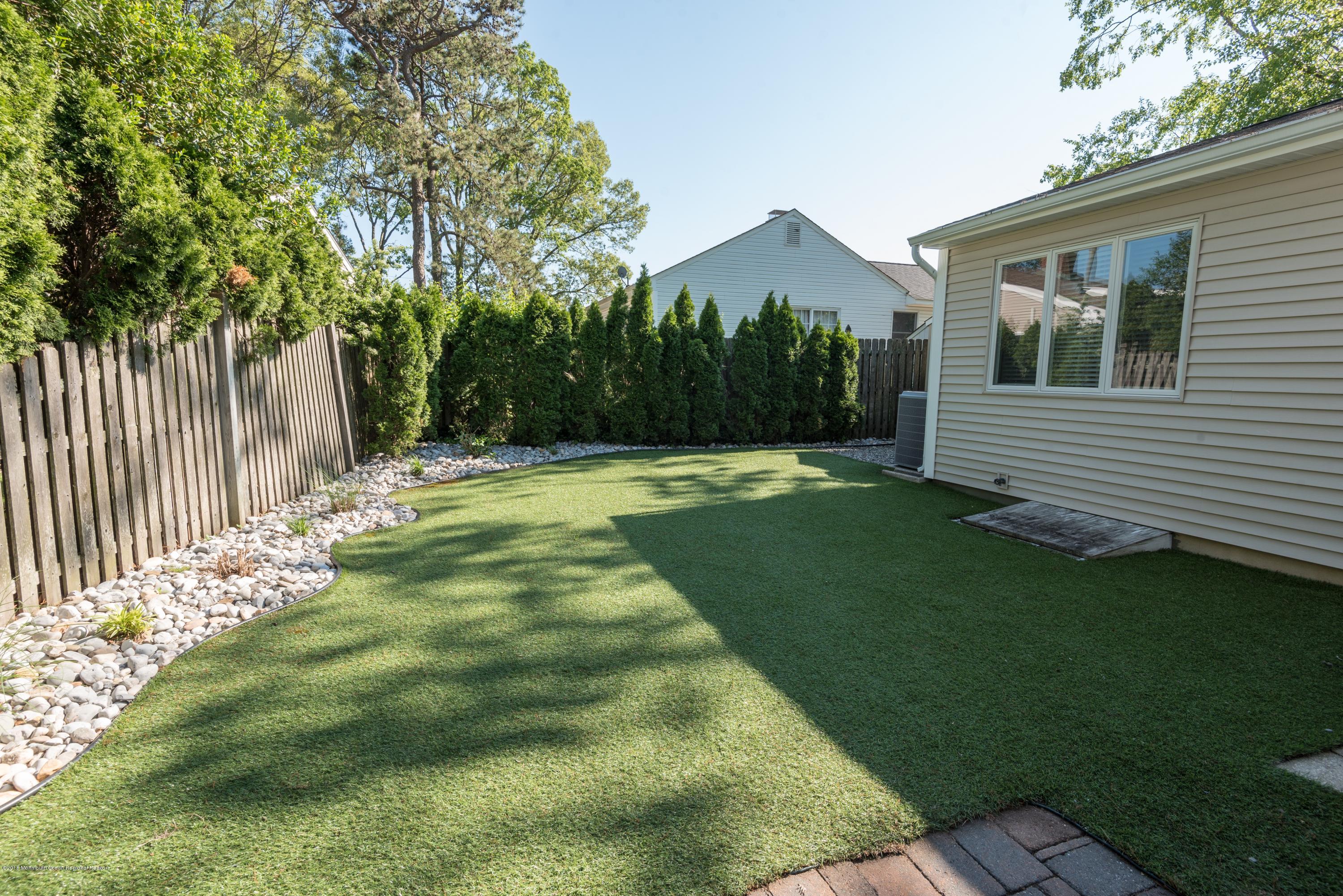 824 Patterson Road Point Pleasant, NJ 08742 - Photo 23 of 28 a backyard of a house with lots of green space