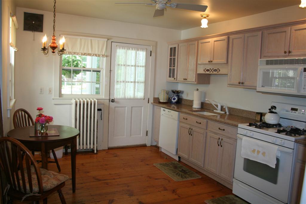 4 Main Road, Unit 4 Monterey, MA 01230 - Photo 4 of 14 a kitchen that has a lot of cabinets in it and appliances