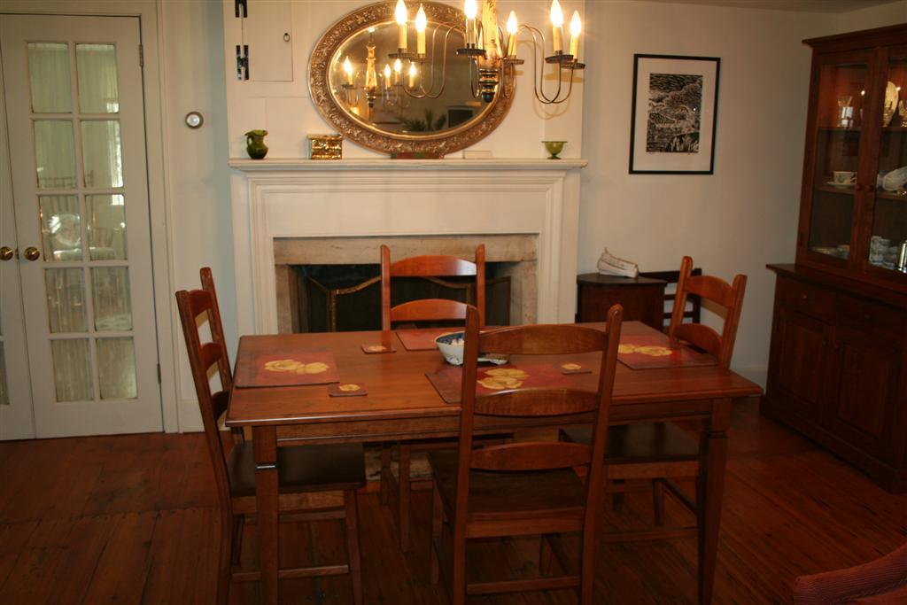 4 Main Road, Unit 4 Monterey, MA 01230 - Photo 5 of 14 a view of a dining room with furniture and a fireplace