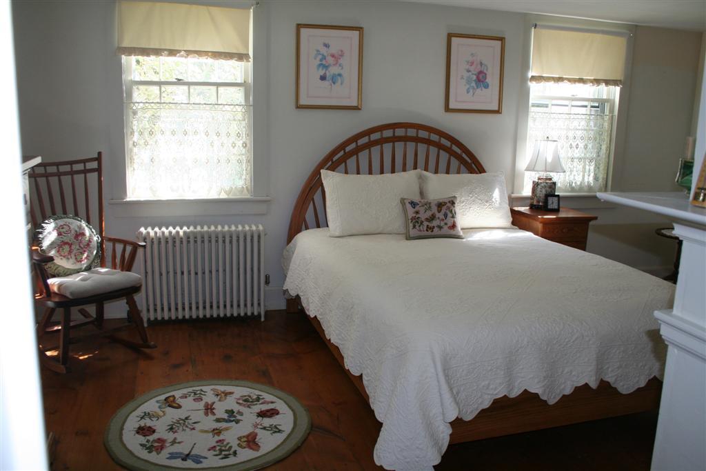 4 Main Road, Unit 4 Monterey, MA 01230 - Photo 7 of 14 a view of a bedroom with a bed and a window