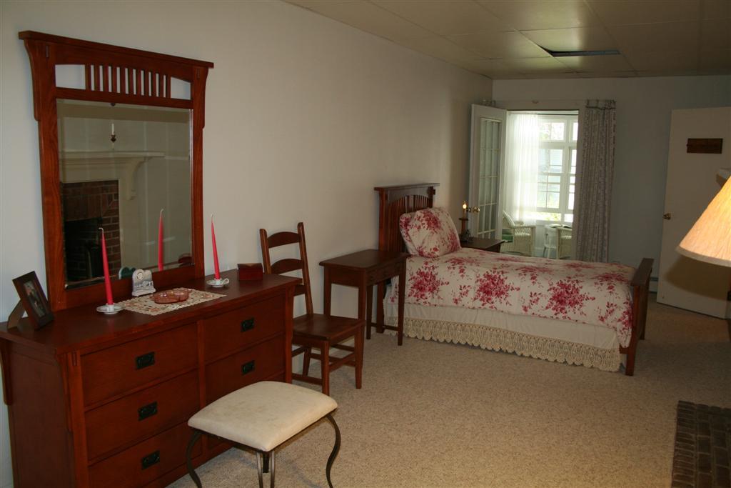 4 Main Road, Unit 4 Monterey, MA 01230 - Photo 9 of 14 a bedroom with a bed and a dresser