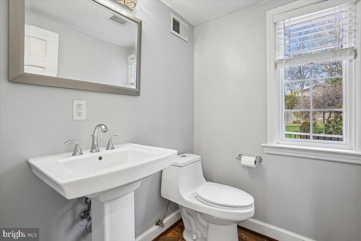 1305 Key Drive Alexandria, VA 22302 - Photo 11 of 64 a bathroom with a sink a toilet and a mirror