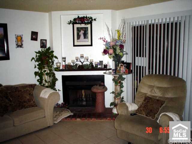 9562 Ball Road, Unit 6 Anaheim, CA 92804 - Photo 1 of 1 Cozy living room with fireplace