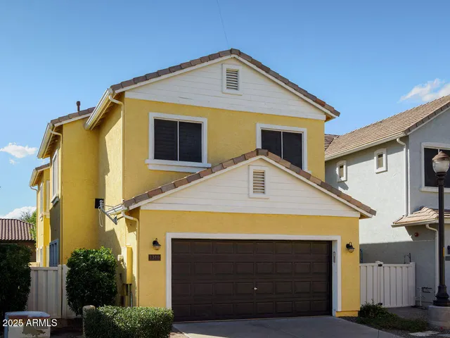 a front view of a house with yard