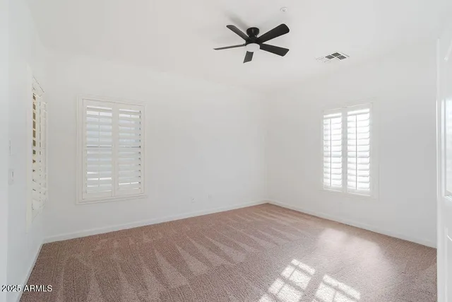 a view of a big room with windows