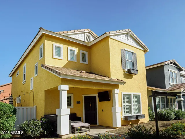 a view of a white building with large windows