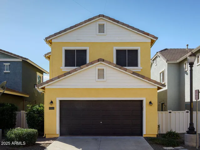 a front view of a house with a garage