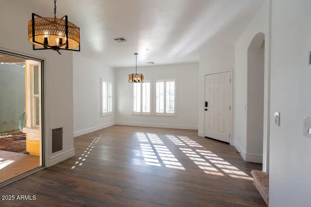 a view of an empty room and window