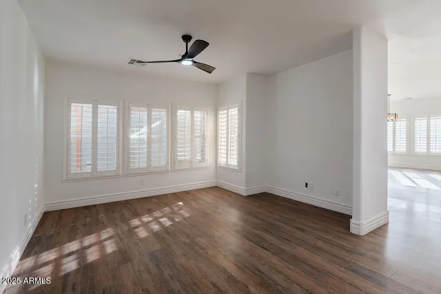 a view of room with hardwood floor and window