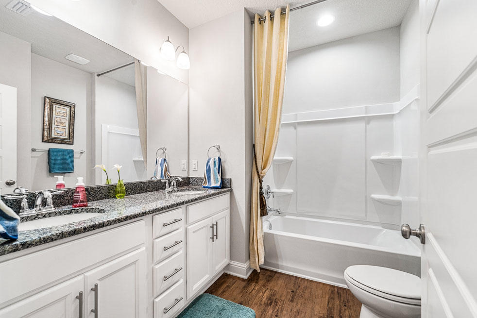 231 Conner Circle Santa Rosa Beach, FL 32459 - Photo 12 of 19 a bathroom with a granite countertop sink toilet and shower