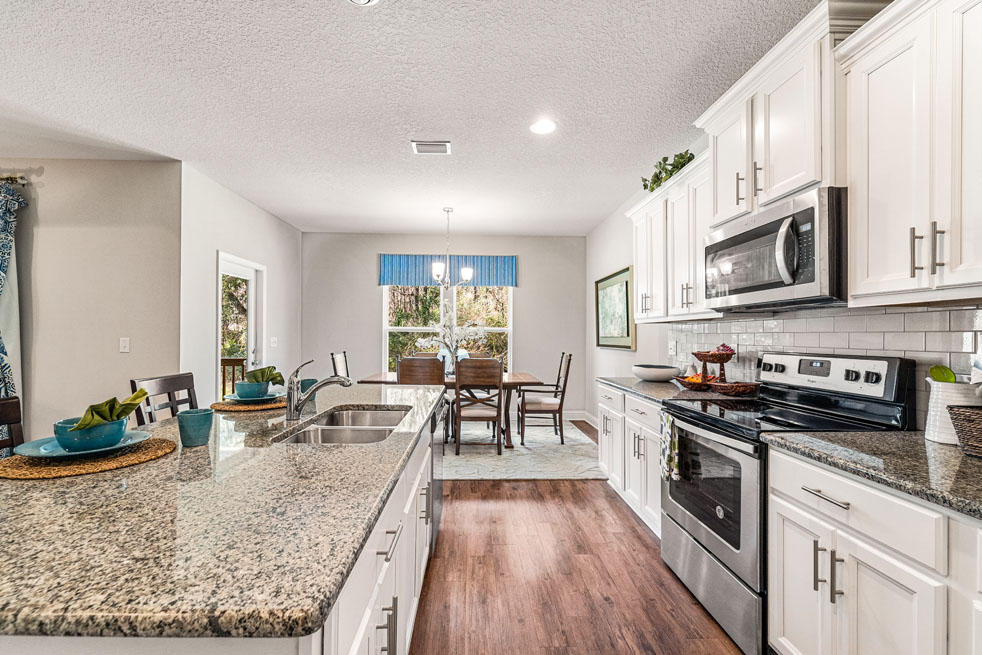 231 Conner Circle Santa Rosa Beach, FL 32459 - Photo 9 of 19 a view of a kitchen with microwave and cabinets