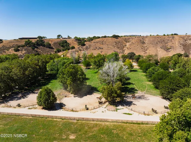 a view of a swimming pool with lounge chairs