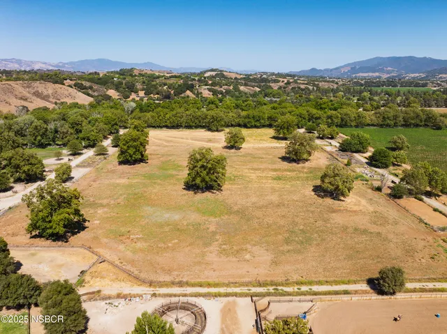 a view of a patio with table and chairs and a fire pit