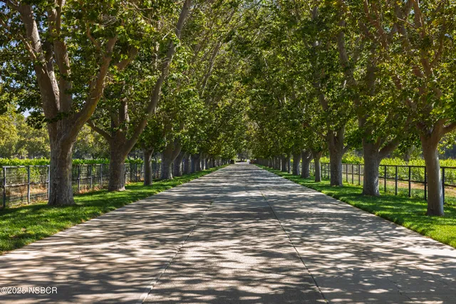 an aerial view of residential houses and outdoor space