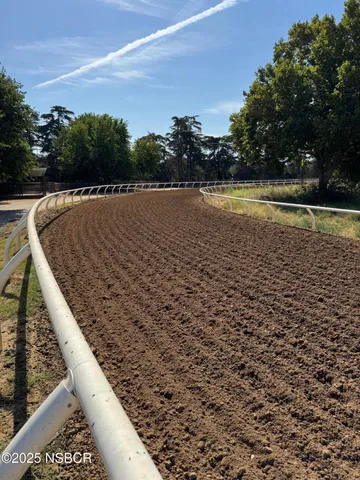 a view of a town with mountains in the background