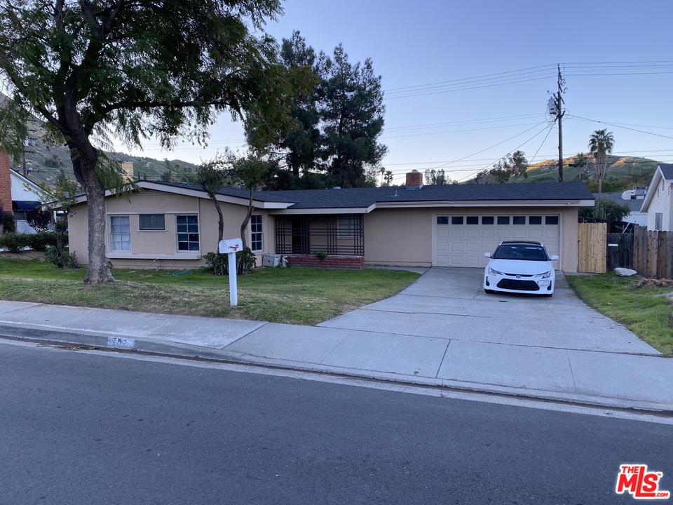 a car parked in front of the house