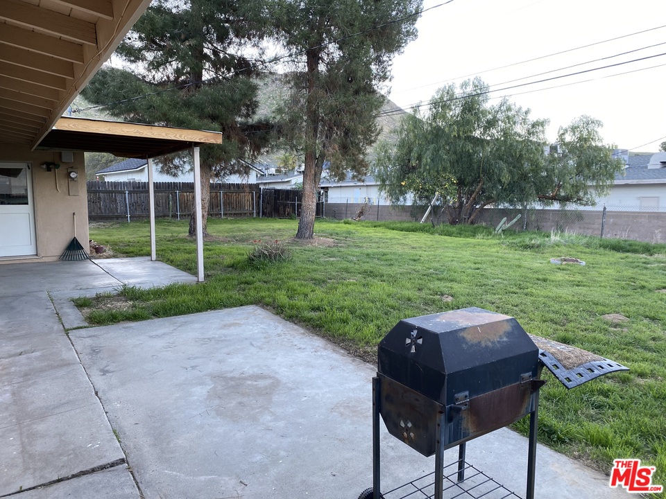 202 Spieth Way Riverside, CA 92507 - Photo 4 of 16 a view of a chair and table in backyard of the house