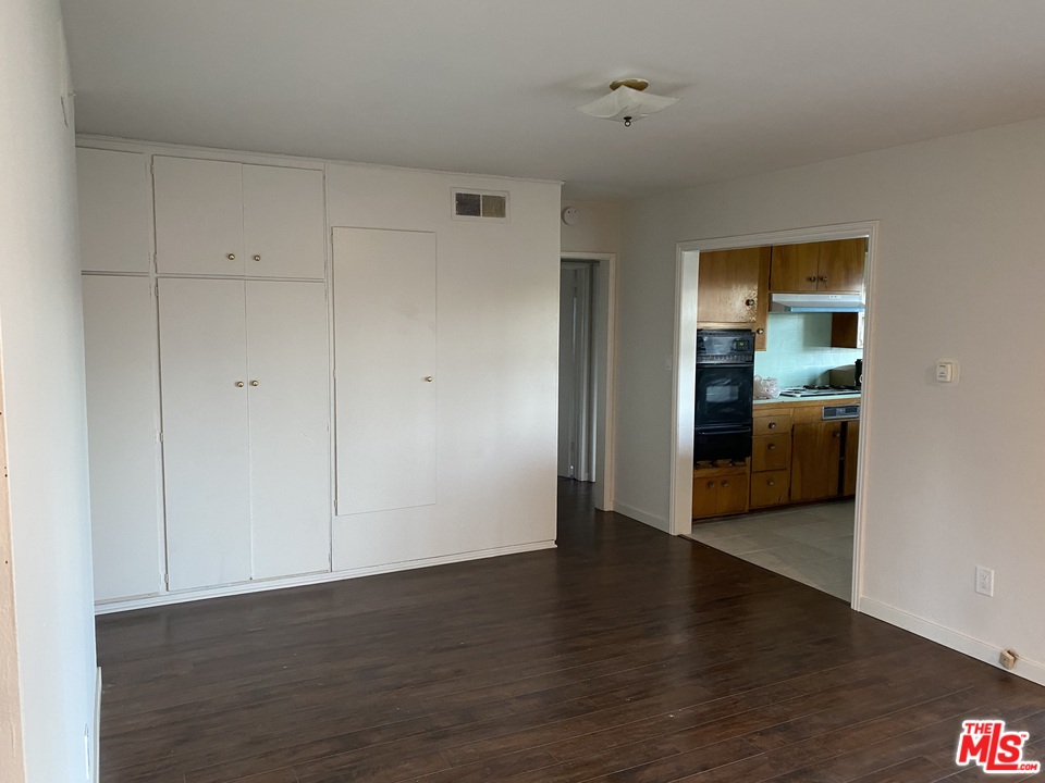 202 Spieth Way Riverside, CA 92507 - Photo 8 of 16 a view of a room with wooden floor and cabinet