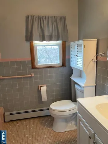 a bathroom with a toilet and a sink