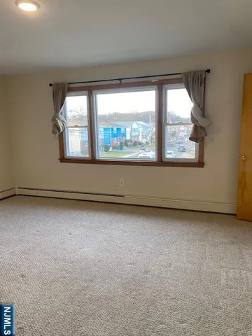 an empty room with a large window