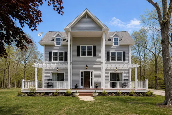 a front view of a house with a yard