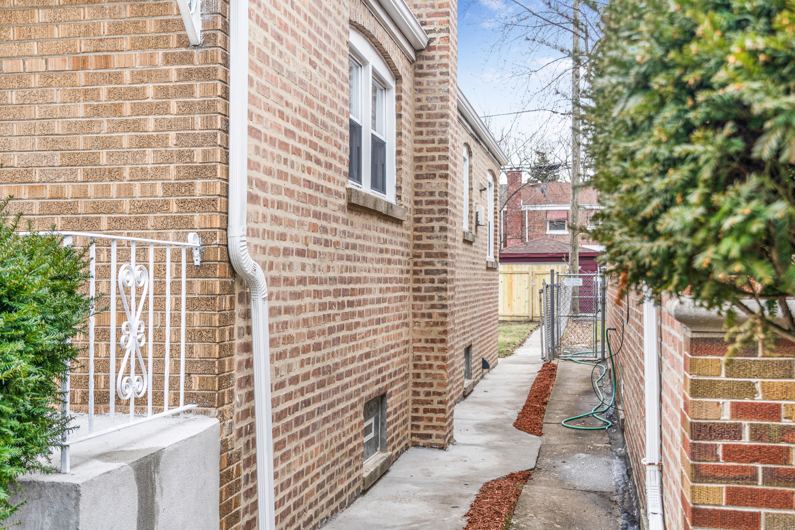 9710 South Chappel Avenue Chicago, IL 60617 - Photo 2 of 29 a pathway of a house with a yard