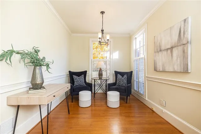 a view of a dining room with furniture window and wooden floor
