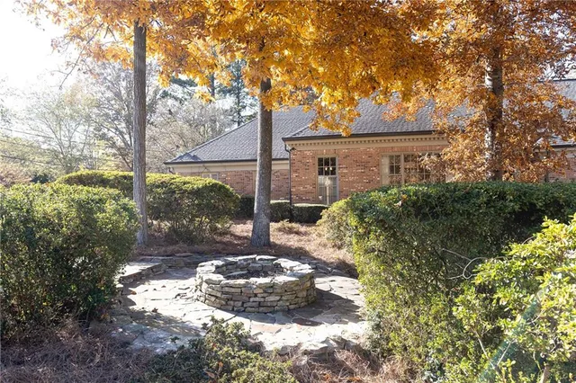 a view of a tree in front of a house