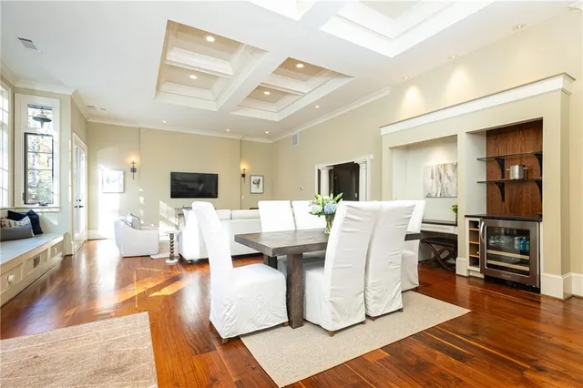 a living room with fireplace furniture and a wooden floor