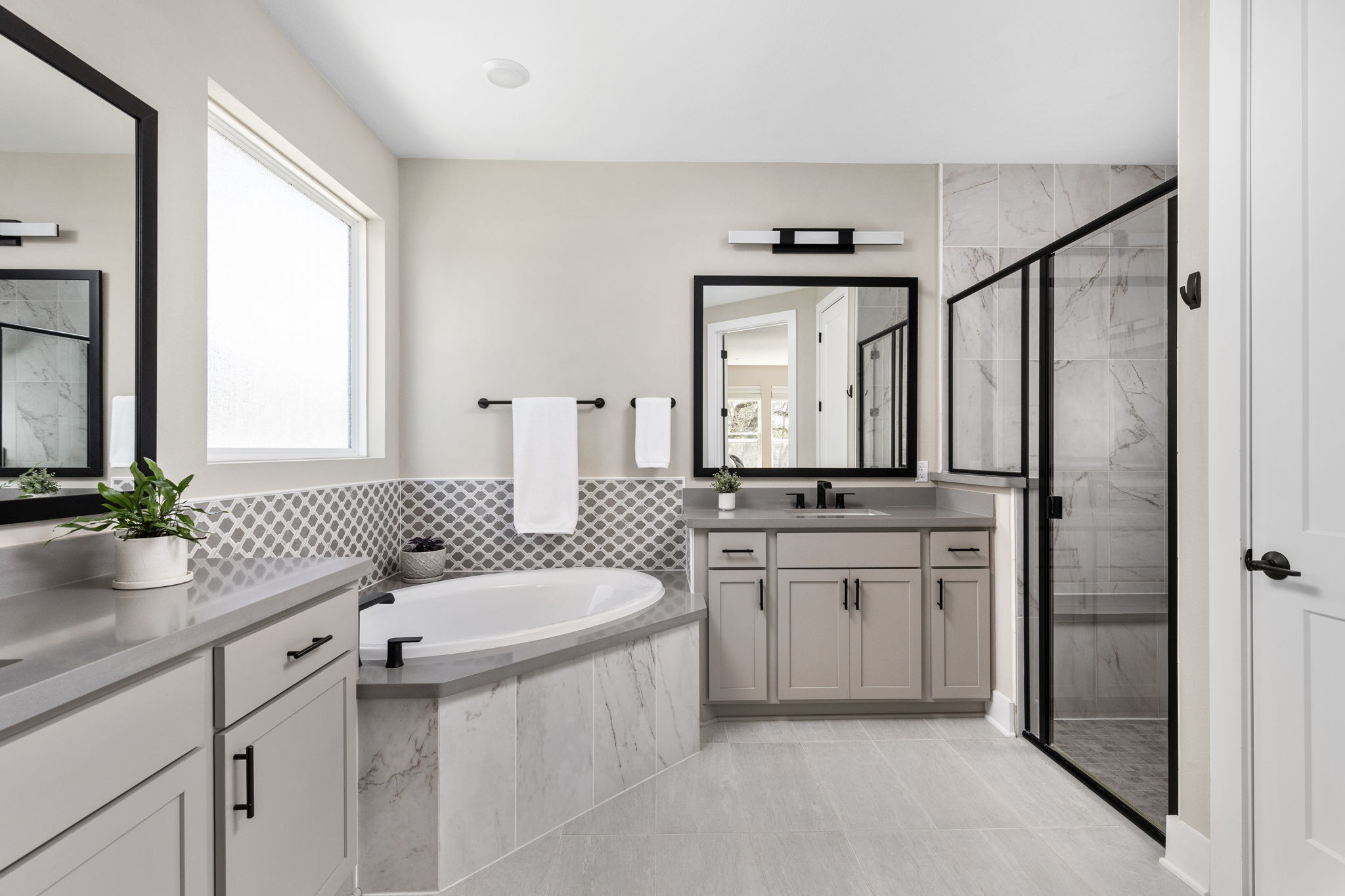 829 Pink Granite Boulevard Dripping Springs, TX 78620 - Photo 11 of 30 Private en-suite bath offers comfort and functionality.