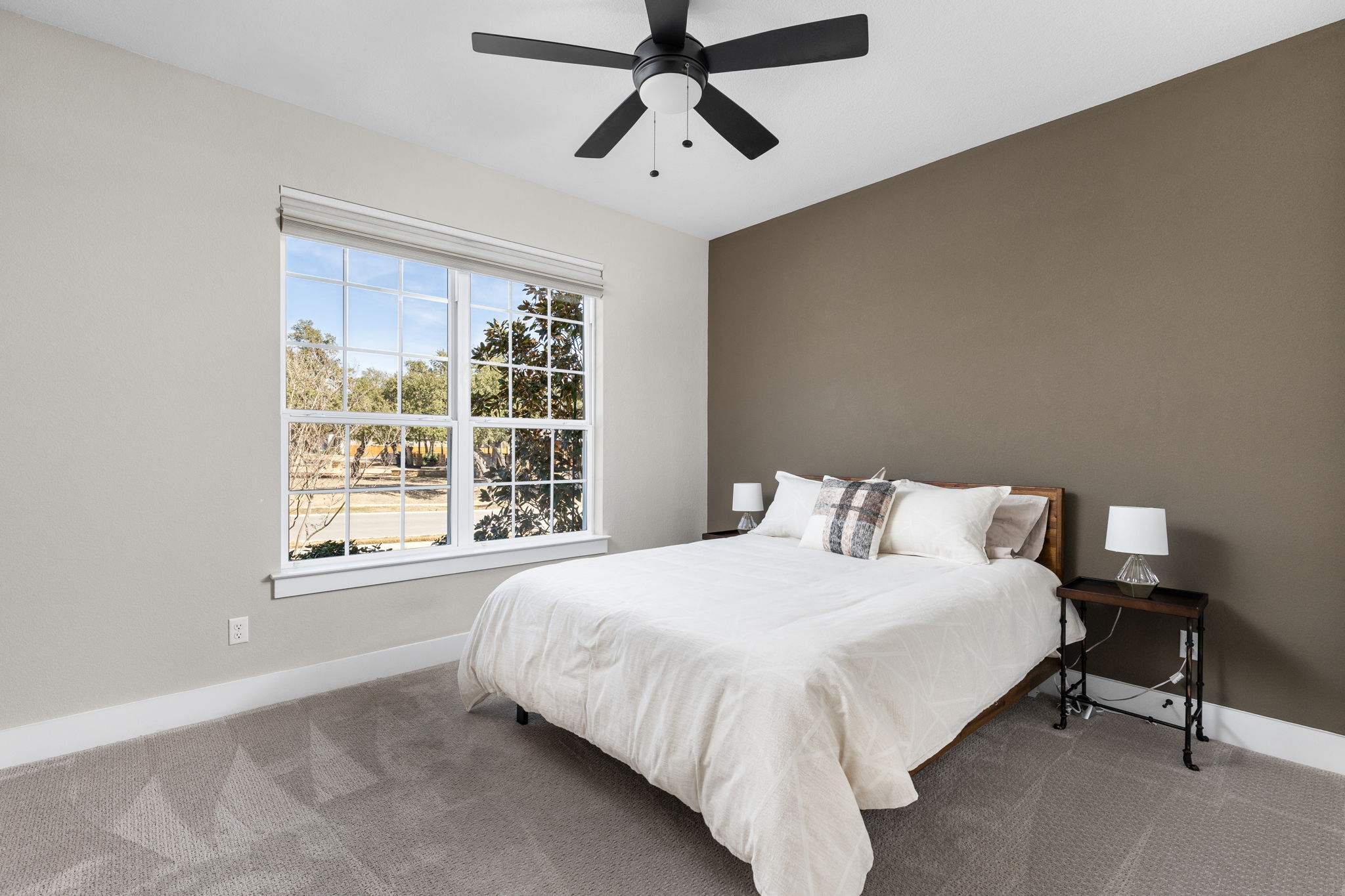 829 Pink Granite Boulevard Dripping Springs, TX 78620 - Photo 12 of 30 Three additional bedrooms provide flexibility for guests or family.